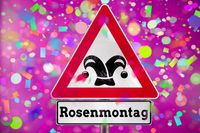 Rosenmontag buntes Schild mit Konfetti und fröhlicher Stimmung für Karnevalsumzüge