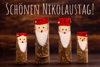 Grüße zum Nikolaus - schönen Nikolaustag, neben Nikolaus aus holz.