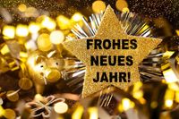 Neujahrswünsche Frohes Neues Jahr mit goldenem Stern und Glücksschwein.