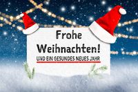 Frohe Weihnachten und ein gesundes neues Jahr auf einem Schild mit Weihnachtsdekoration.