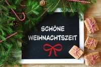 Sprüche zur Weihnachtszeit, Tafel mit „Schöne Weihnachtszeit“ und Tannenzweigen.